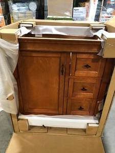 lot 31 image: Home Decorators Collection Naples 30 in. W x 21.63 in. D Vanity Cabinet Only in Warm Cinnamon with Right Hand Drawers   Customer Returns See Pictures