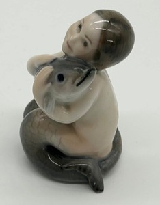 lot 124 image: Royal Copenhagen Merchild Figurine #2348