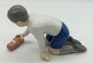lot 139 image: Bing & Grndahl Boy with Car Porcelain Figurine