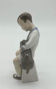 lot 314 image: Bing & Grndahl Boy Sitting with Dog Porcelain Figurine 2201