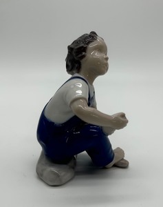 lot 316 image: Bing & Grndahl Boy Putting on Shoe Porcelain Figurine  #2275