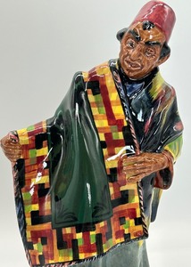lot 79 image: Royal Doulton Carpet Seller Figurine HN 1464