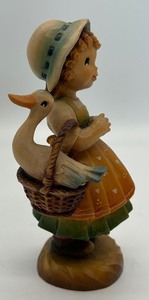 lot 249 image: Vintage Hand Carved Anri Bewildered Girl With a Goose in a Basket Figurine