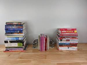 lot 174 image: An Assortment of Books and a Giraffe Bookends K