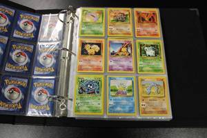 lot 98 image: Pokemon Lot of Vintage or Modern Reverse Holo Cards In Pages  300 Cards