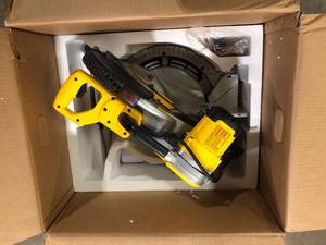 lot 26 image: DEWALT 15 Amp Corded 12 in. Compound Double Bevel Miter Saw    Customer Returns See Pictures