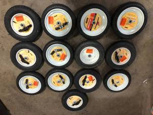 lot 35 image: Lot of 14.5 in. x 3.2 in. x 14.5 in. Universal Fit Wheelbarrow Flat Free Tire and Wheel Assembly   Customer Returns See Pictures
