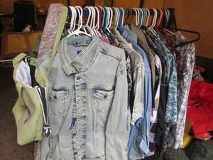 lot 263 image: Sturdy metal clothes rack filled with clothes