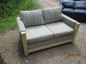lot 161 image: Upholstered 2-cushion waiting room style love seat with wood trim and accents