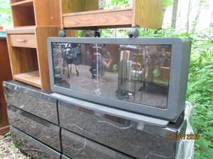 lot 174 image: Black TV stand with glass door