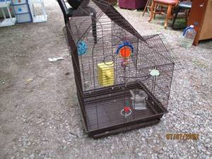 lot 180 image: 30 brown wire bird cage with toys.