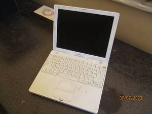 lot 211 image: Vintage Apple laptop.