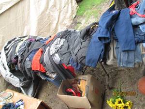 lot 194 image: 3 tables filled with clothes