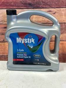 lot 50 image: New Mystik JT4 2 Cycle Synthetic Blend Oil