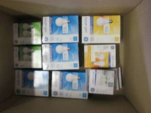 box of various new light bulbs ...
