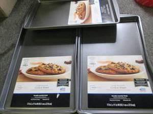 3 large cookie sheets dented on one...