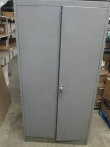 2 door metal cabinet with oil drain...