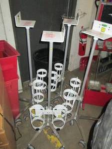 4 white poles on wheels...