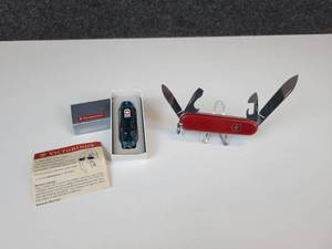 lot 874 image: Pair of Victorinox Swiss Army Knives - Sapphire Signature Lite Swiss Army Knife with LED Mini Light and Swiss Army Recruit Knife