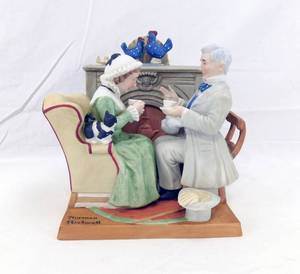 lot 59 image: The Danbury Mint Norman Rockwell Four Ages of Love - Gaily Sharing Vintage Times Porcelain Figurine