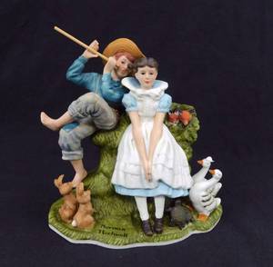 lot 74 image: The Danbury Mint Norman Rockwell Four Ages of Love - Sweet Song so Young Porcelain Figure Collection