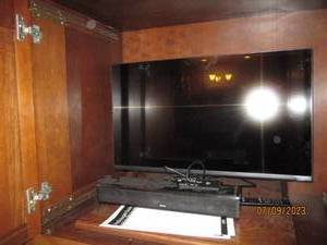 lot 17 image: Vizio flat screen TV and Zvox Audio...