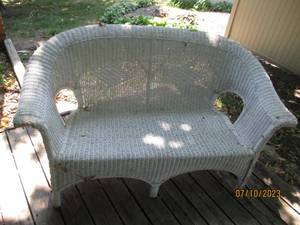 lot 76 image: White Wicker Rattan outdoor loveseat
