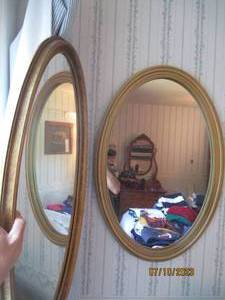 lot 111 image: (2) oval shaped Decorative wall mirrors