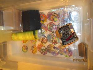 lot 160 image: Vintage Pog chips, shooters and accessories