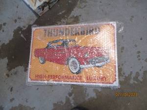 lot 298 image: Tin Thunderbird High performance garage style sign
