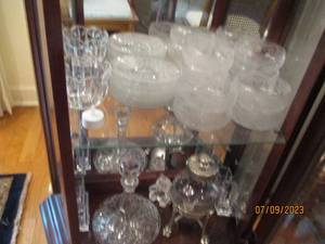 lot 33 image: Large grouping of cut glass decanter, servingware and decor.