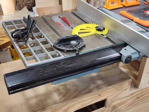 lot 26 image: Professionally Built Delta Table Saw  Porter Cable Router Combo Rolling Cabinet