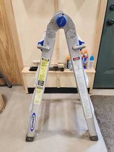 lot 46 image: Werner 300-lb 13ft Folding Aluminum Ladder