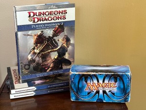 lot 158 image: Three Dungeons and Dragons Player Handbooks and Magic the Gathering Cards