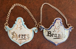 lot 279 image: Pretty Porcelain Decanter Labels