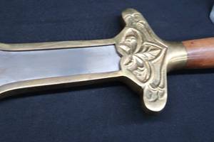 lot 3 image: ORNATE LARGE SWORD WITH WOOD AND BRASS HANDLE.