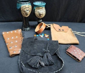 lot 122 image: RENISSANCE POTTERY MUGS AND LEATHER GOODIES