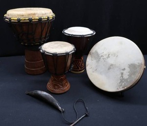 lot 85 image: QUARTET OF  BONGO KAMBALA  DRUMS AND AN ATOKE BELL