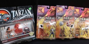 lot 102 image: TARZAN AND HIS BUDDY DRAGONHEART ACTION FIGURES