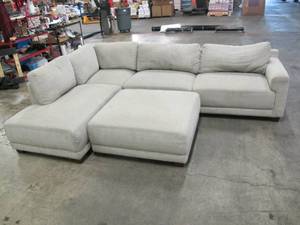 lot 186 image: Raylin Modern 2-piece Fabric Sectional with Ottoman - Light Gray - Minor Tear