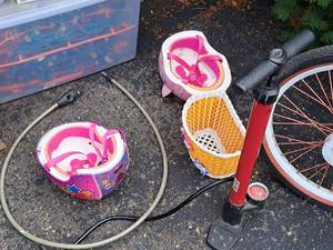 lot 167 image: Bicycle Accessories - Hello Kitty Helmet, Super Star Helmet, Bicycle Tire Pump, Bicycle Lock and Front Basket