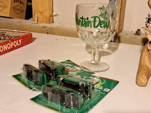 lot 276 image: Lot of (3) Mountain Dew Collectibles - Beer Glass, Diecast Cars