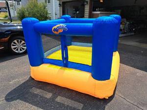 lot 268 image: Inflatable Bouncer with Manley 10 Electric Outdoor Blower
