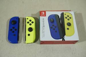 lot 175 image: Nintendo Switch Joy-Con Blue & Neon Yellow