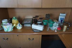 lot 395 image: Assorted Home Decor -Candle Holders, Pineapple Statue, Picture Frames, Vases