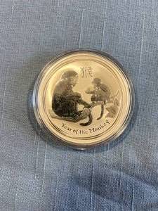 lot 5 image: 2016 One Ounce BU Australia Year of the Monkey Silver Dollar