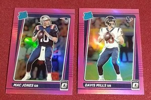 lot 149 image: (2) 2021 Optic Pink Holo Rated Rookie Cards - Mac Jones & Davis Mills