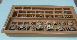lot 29 image: Vintage...Plastic Display of Various Sized Hose Clamps