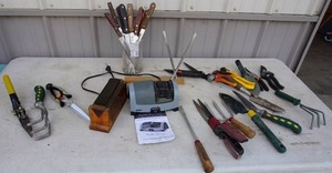 lot 88 image: Miscellaneous...Knife Sharpener, Knives, Clippers, Grass ShearsRakes Etc.