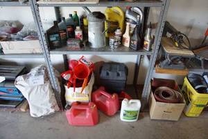 lot 75 image: GarageMotorAutomobile...Two Shelves of Oil, Lubricants, Funnels, Gas Cans and MORE